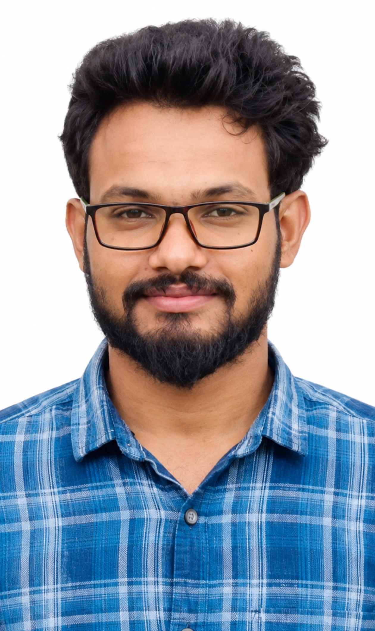Portrait photo of a man wearing glasses and a blue checkered shirt.